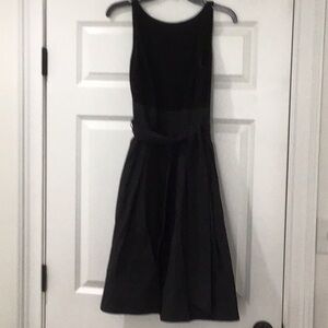 Lauren sleeveless black dress with taffeta skirt.